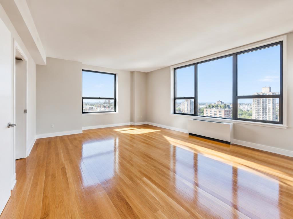 Empty, freshly cleaned apartment with gleaming hardwood floors